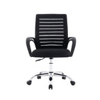 LEVO Silla Lite — en escritorio de estudio con notebook abierto