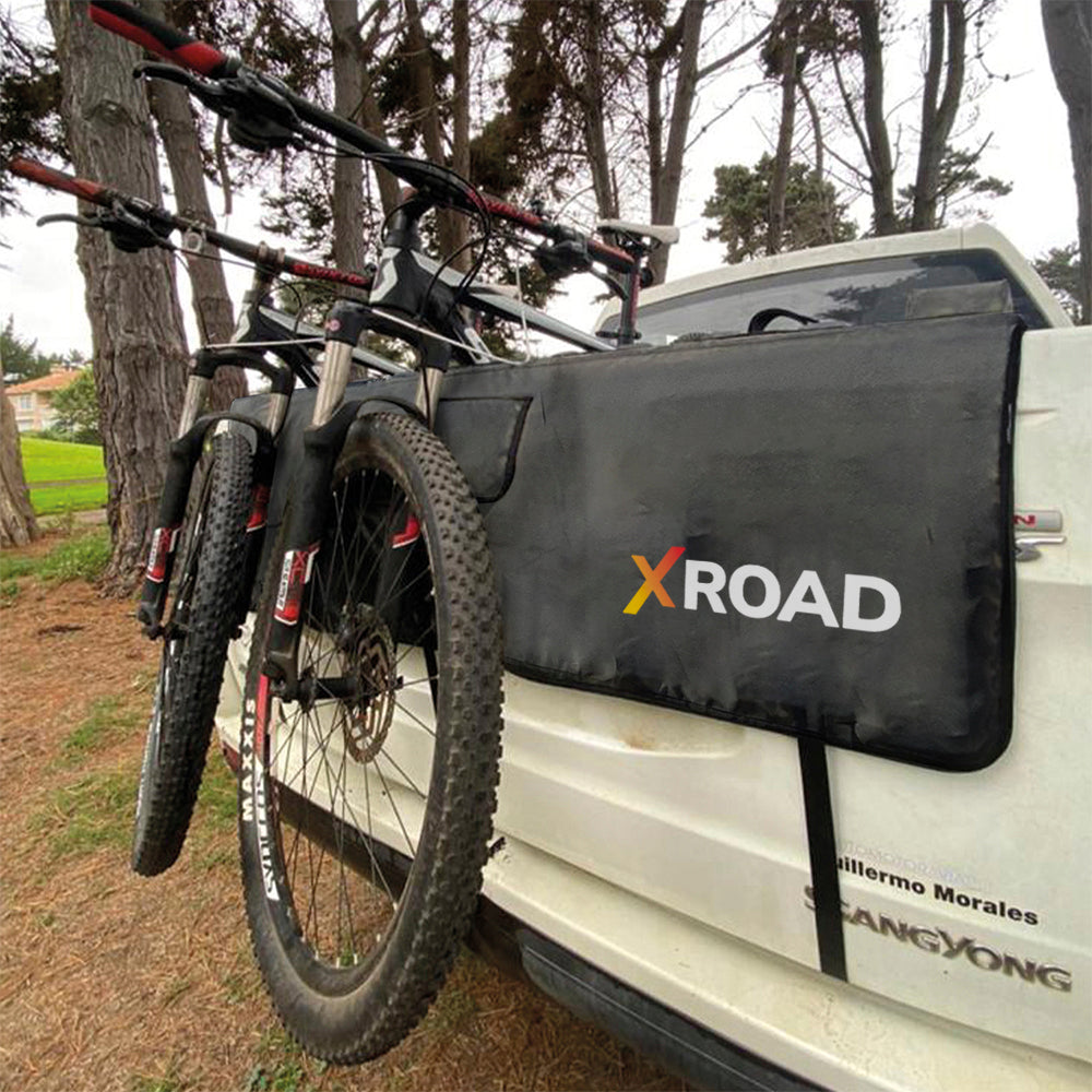 Pick-up Pad Xroad instalado en camioneta con dos bicicletas